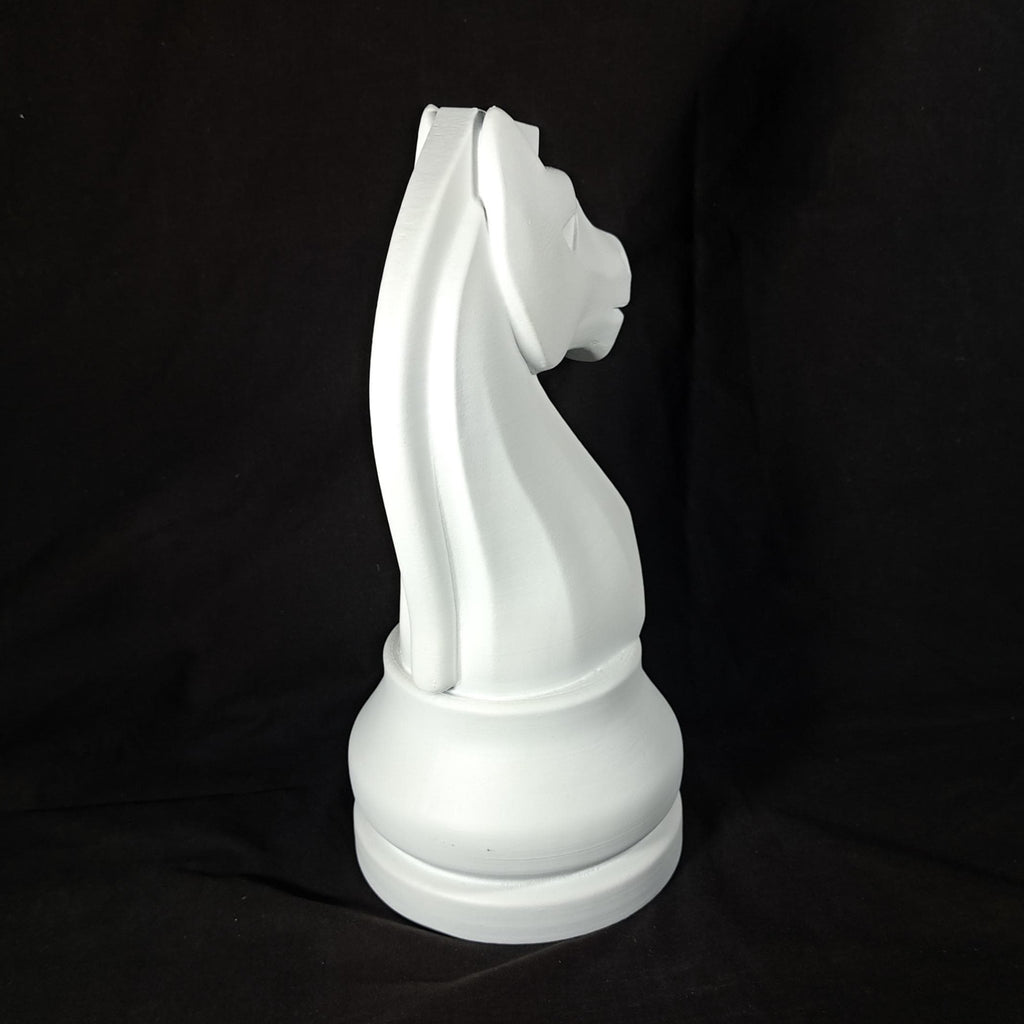 White chess piece on a black background