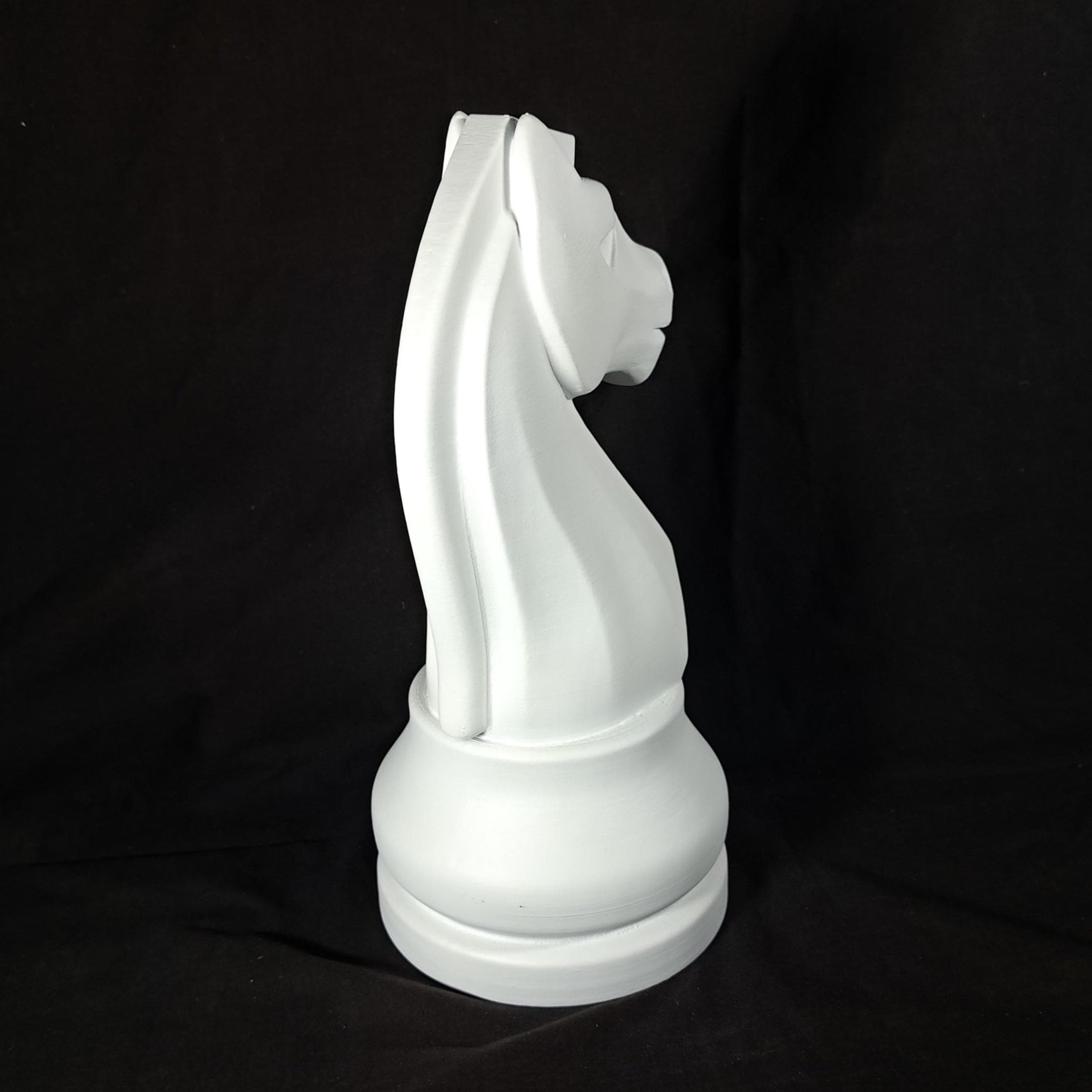 White chess piece on a black background