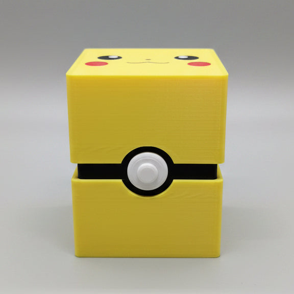 Front view of 3D printed Pikachu Pokémon deck box in bright yellow with black Poké Ball clasp band, white button, and Pikachu face lid art with red cheeks.