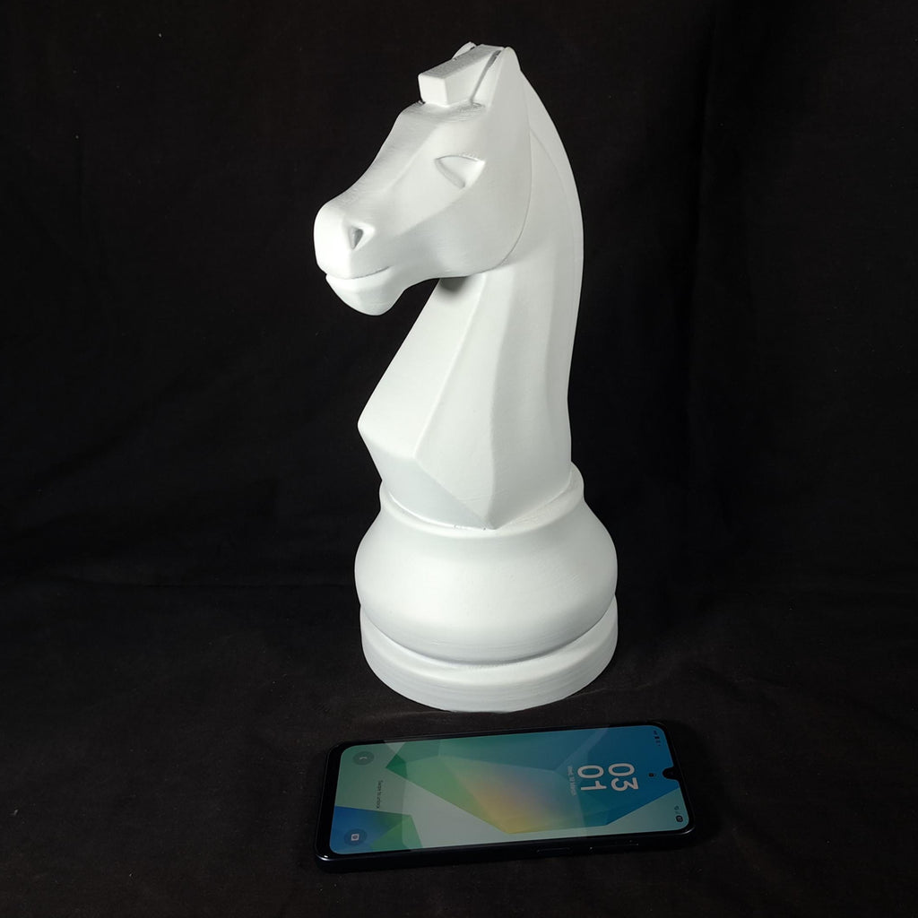 White chess piece on a black background with a smartphone