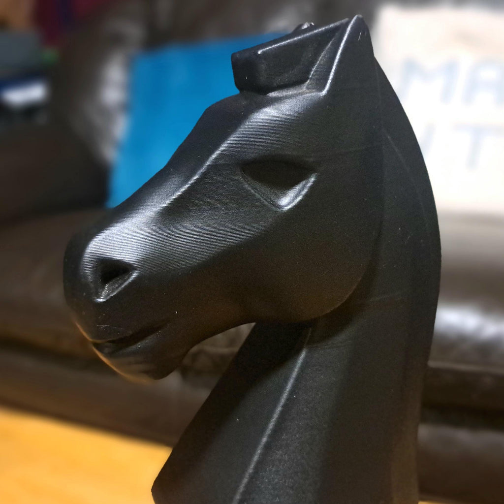Clos up shot of black knight chess piece