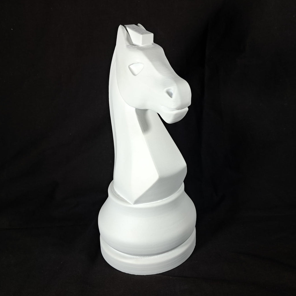 White chess piece on a black background