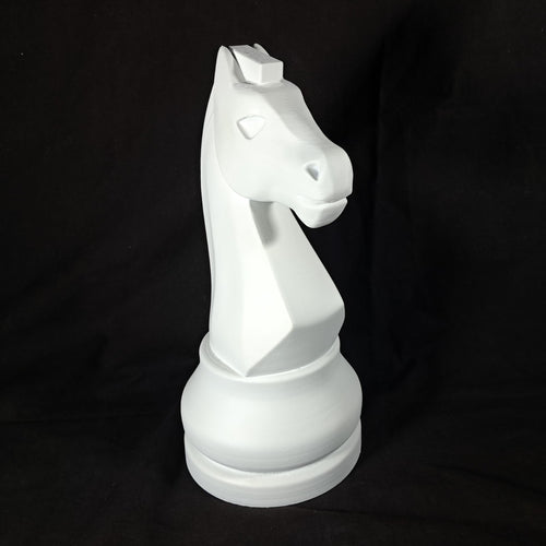 White chess piece on a black background