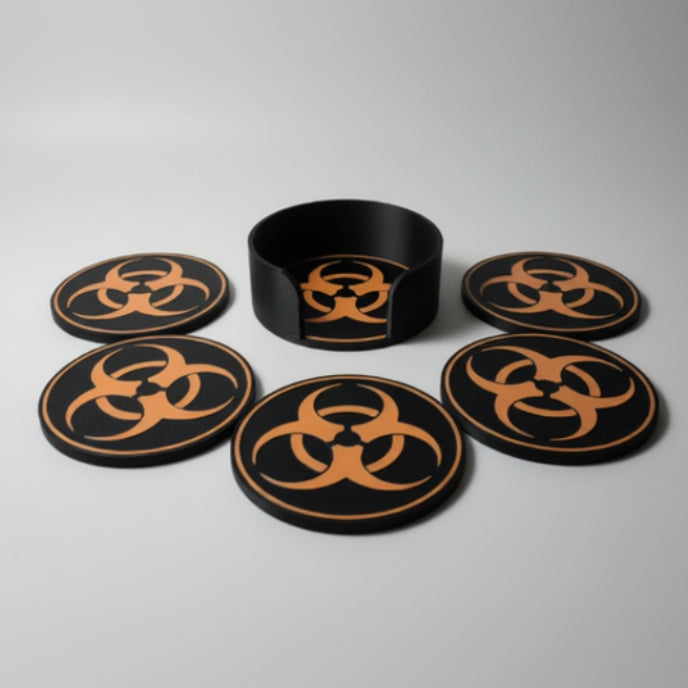 Set of coasters with biohazard symbols on a grey background.