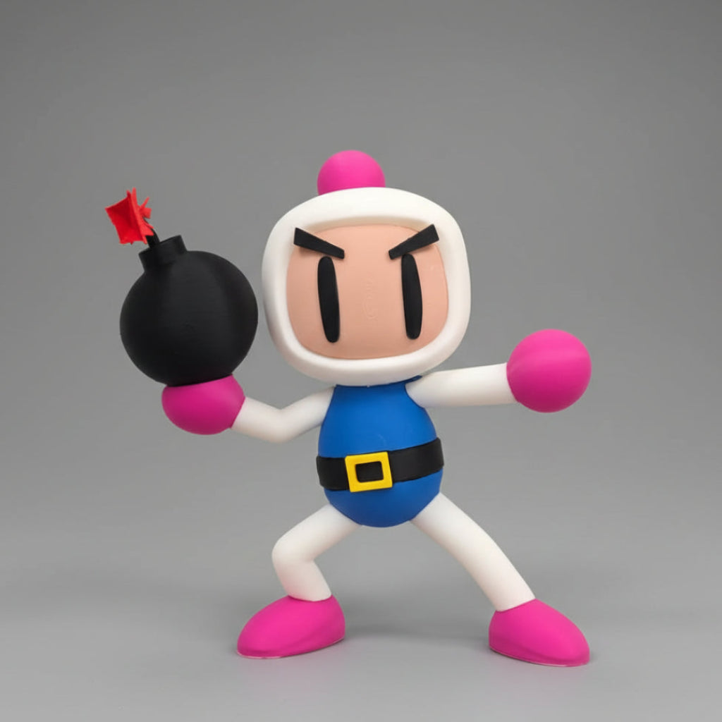 A 3D-printed Bomberman figurine holding a black bomb in an action pose against a plain gray background.