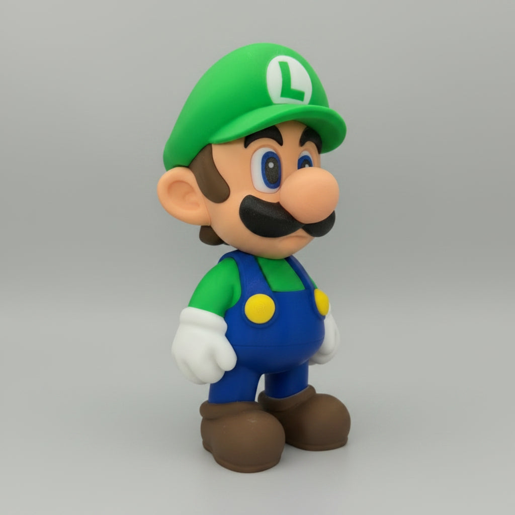Luigi figurine with green hat and blue overalls on a grey background