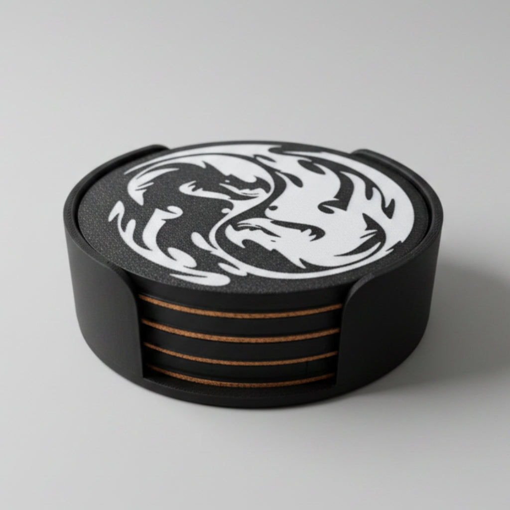 A stack of black and white dragon coasters on a grey background.