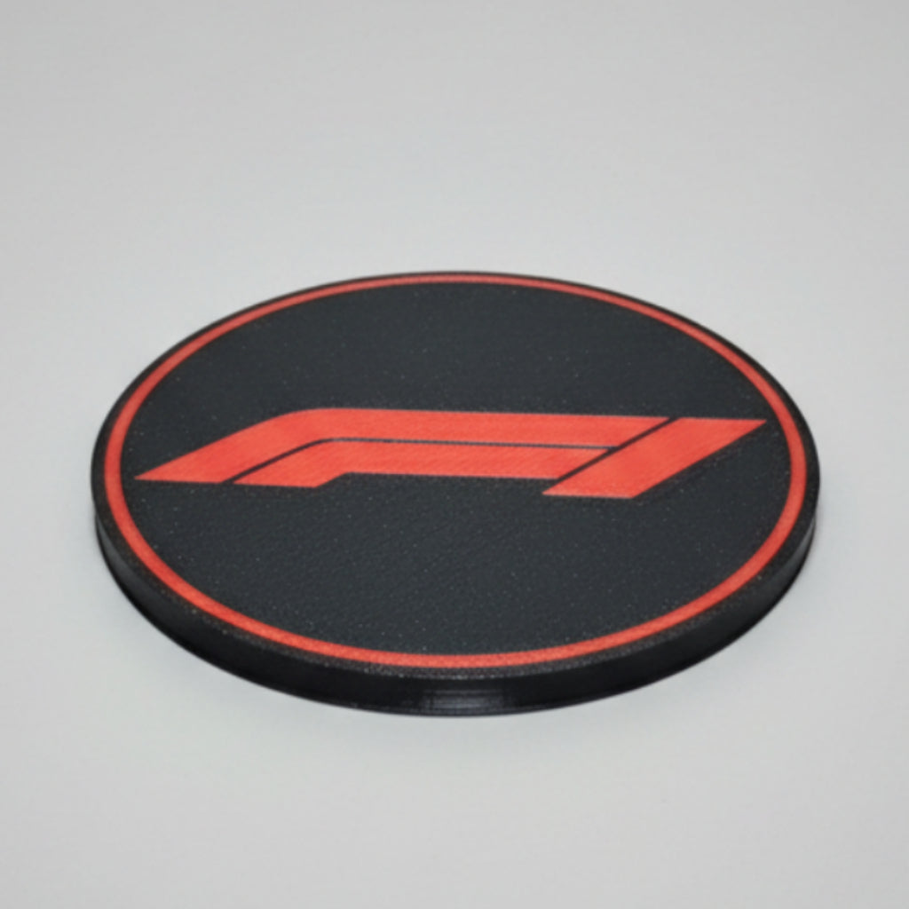 F1 themed coaster on a grey background.