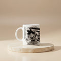 A white ceramic mug featuring a black and white graphic print of the anime character Goku.