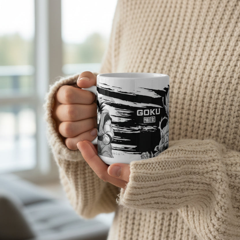 A white ceramic mug featuring a black and white Dragon Ball Z anime graphic with Goku and the word 'GOKU' printed on the side, set against a plain white background.