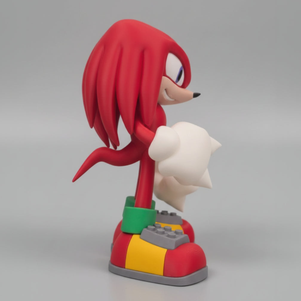 Side view of knuckles the echidna figure on a grey background.