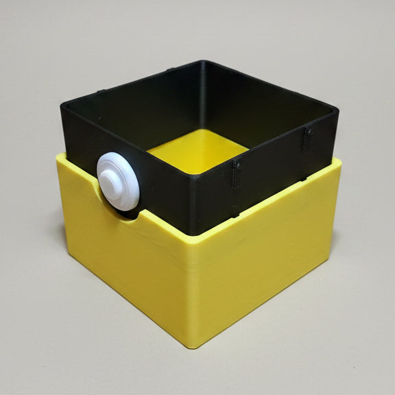 3D printed Pikachu Pokémon deck box with black inner tray lifted from yellow base, showing two-part construction and white button clasp, yellow interior visible.