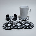 Poker-themed coasters on a grey background with a white mug.