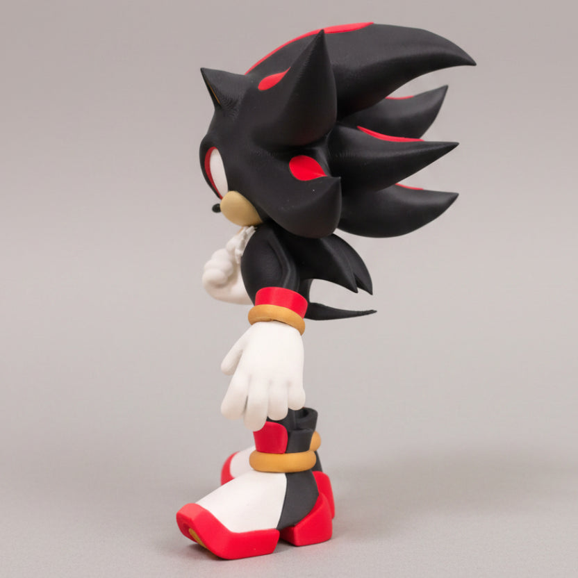 A 3d printed figurine of the character Shadow the Hedgehog, shown from a side profile against a neutral gray background.