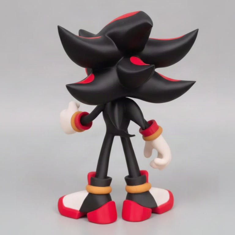A black and red shadow figure with white accents, standing on a gray background.