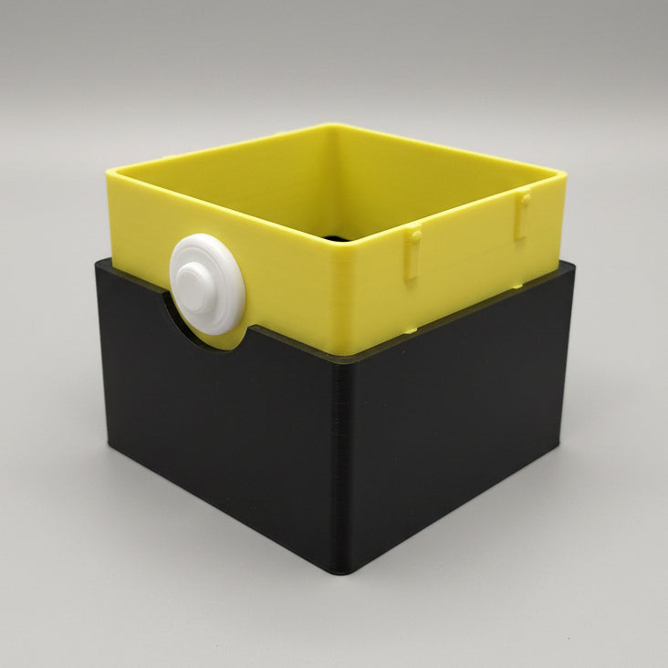 3D printed Umbreon Pokémon deck box with yellow inner tray lifted from matte black base, showing two-part construction and white button clasp.