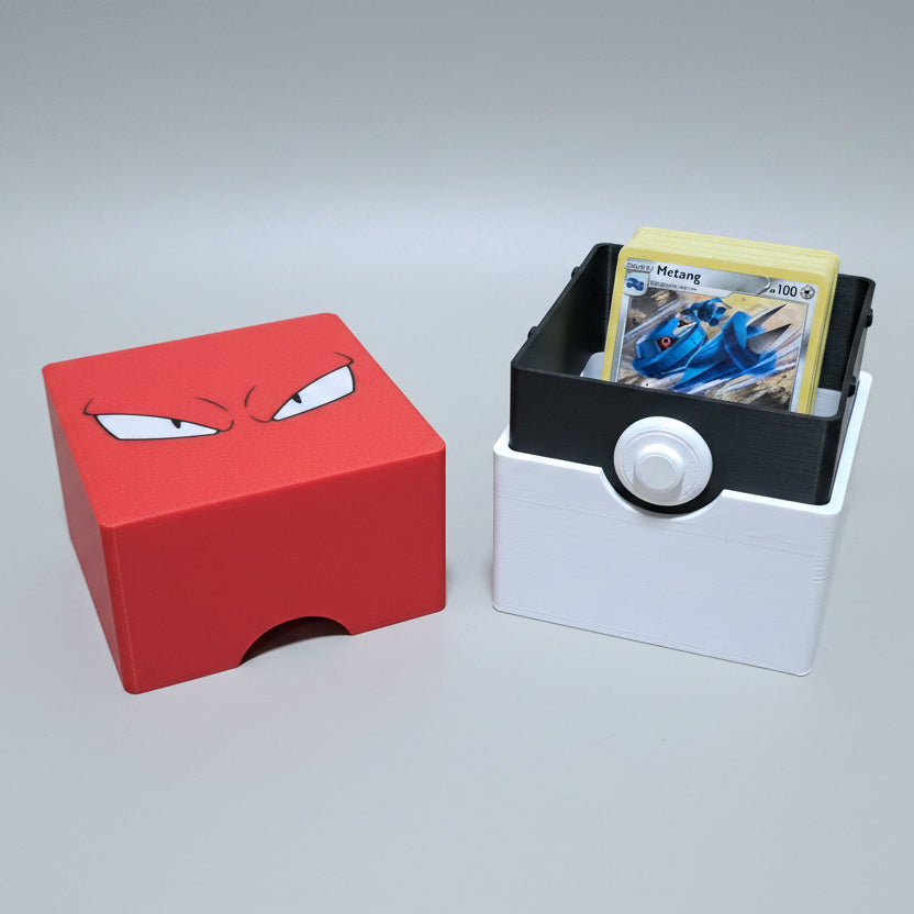 3D printed voltorb trading card deck box in black and white with matching red angry-eyes lid, shown open with a Pokémon card inside.


