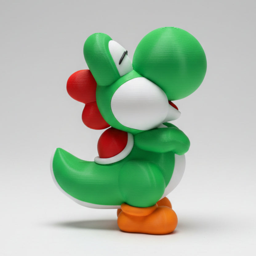 Side profile of a yoshi figure on a grey background.